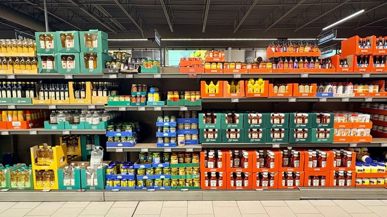 A front facing photo of an aisle of sauces and condiments at Aldi