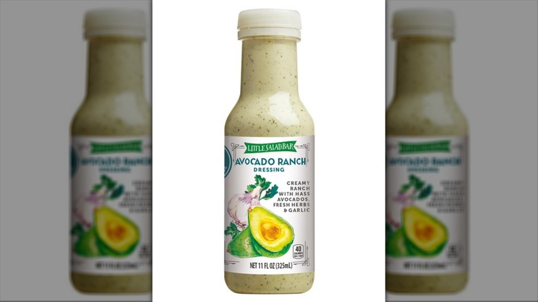 A bottle of Little Salad Bar Avocado Ranch Dressing on a white background.