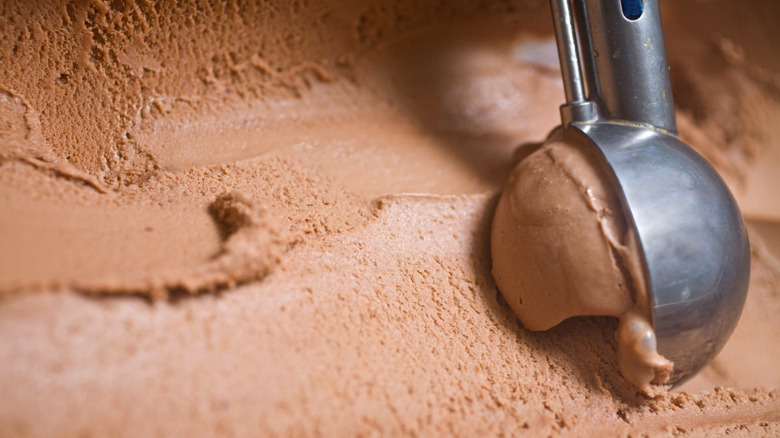 Chocolate ice cream being scooped