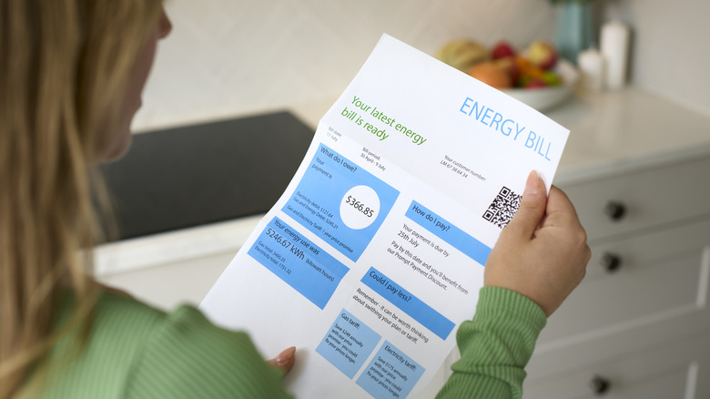 A person reading an energy bill