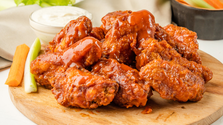 buffalo wings on wooden platter
