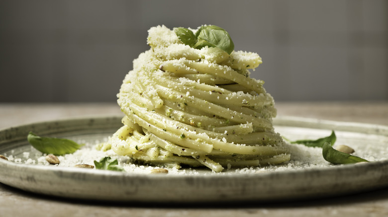 garlic butter noodles on plate with parmesan cheese
