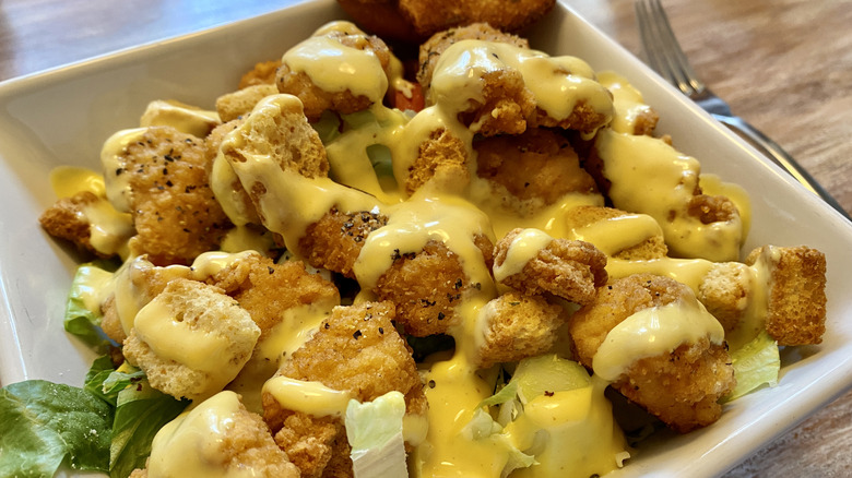chicken salad with honey mustard dressing poured over