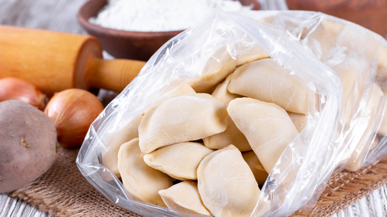 Frozen raw dumplings with potatoes in a plastic bag