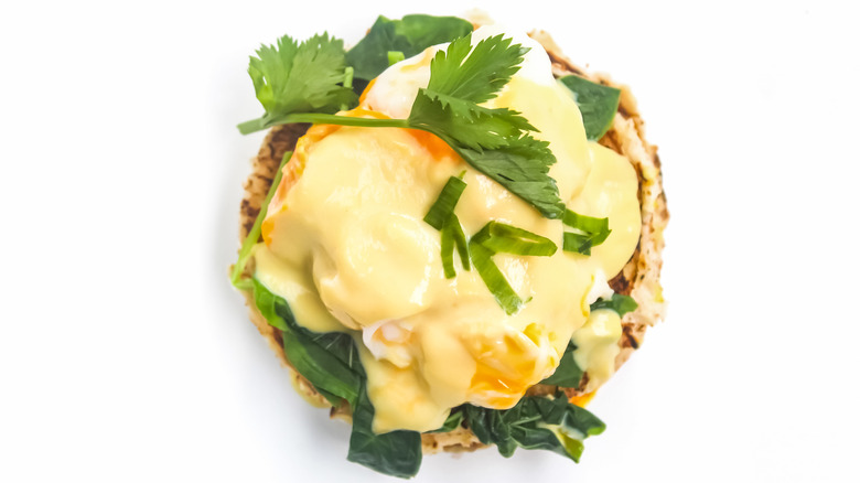 Eggs Benedict with spinach and fresh herbs