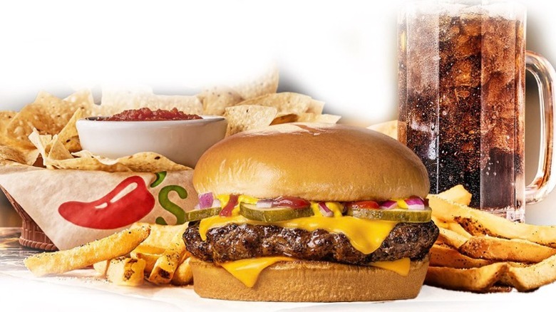 Chili's cheeseburger, fries, chips and salsa, and soda