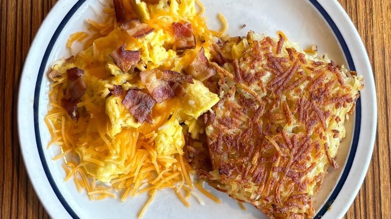 IHOP House Scramble with hash browns on a white plate
