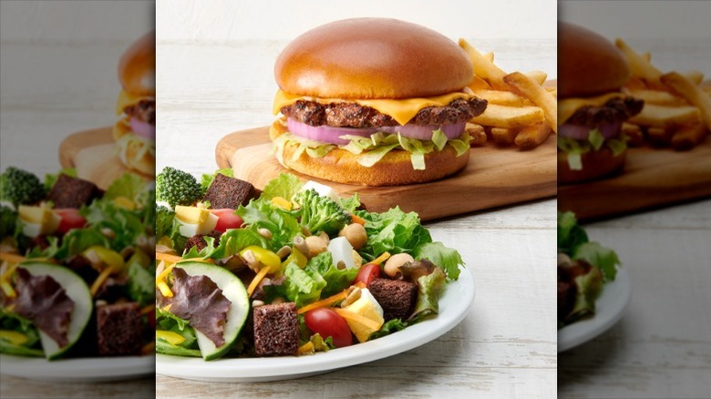 hamburger, fries, and plate of salad from Ruby Tuesday