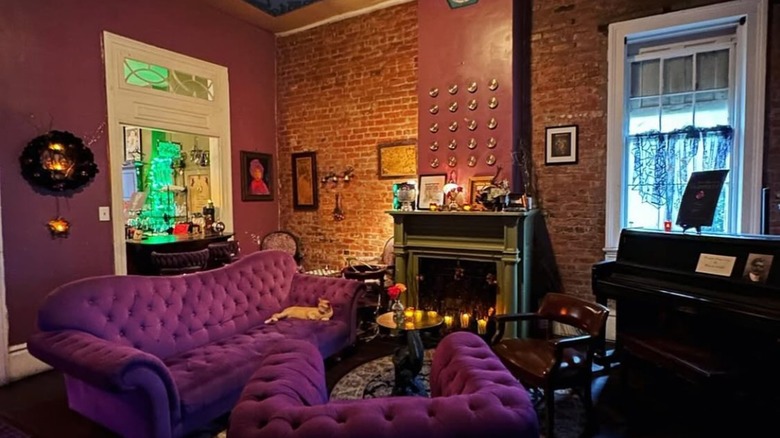 Potions Speakeasy Lounge seating area with plush velvet sofa couches