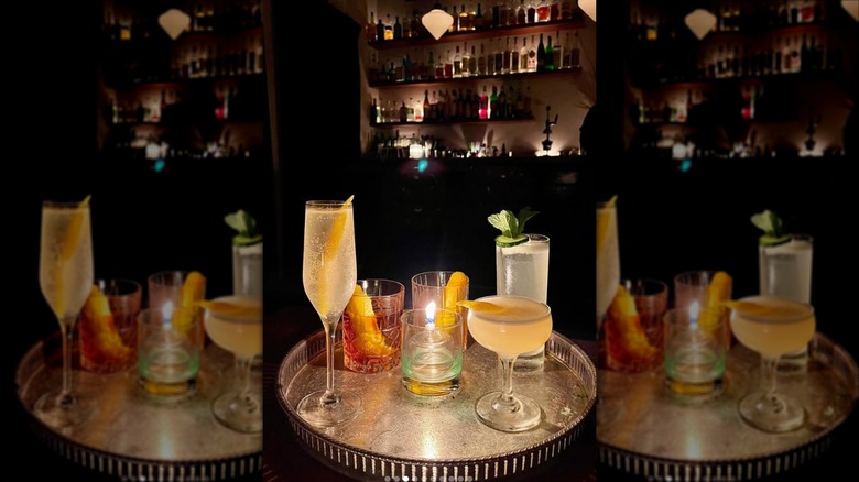 The Annex at Last Saint interior with cocktails and low lighting