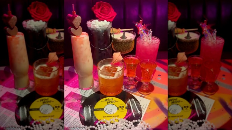 The Woo Woo interior table set up with specialty cocktail Galentine´s Day themed drinks and a Woo Woo logo vinyl record