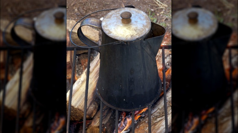 Coffee made the old fashioned way on an open fire in a tin kettle