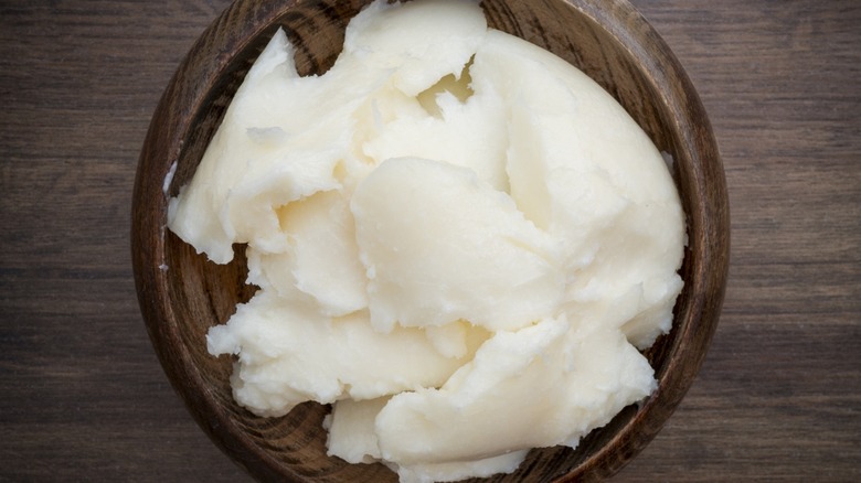 Pork fat in wooden plate, top view