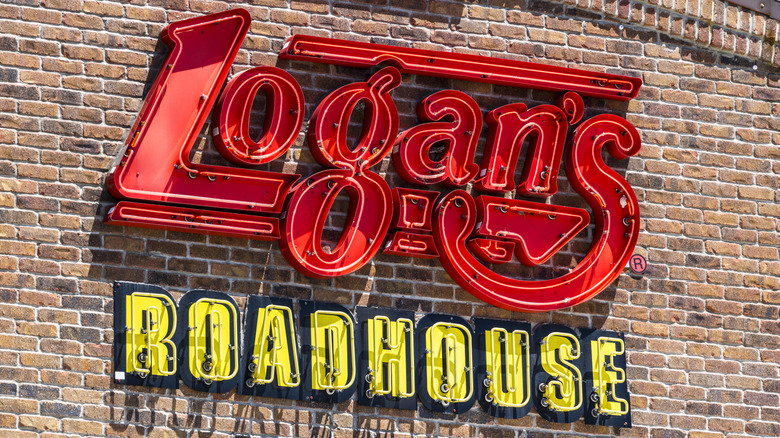 Logan's Roadhouse sign on brick storefront