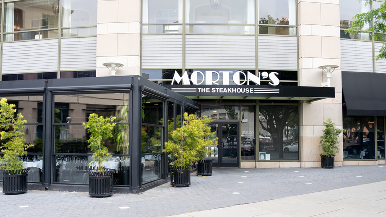 Morton's Steakhouse storefront with miniature trees