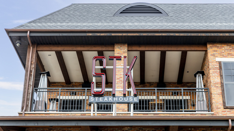 STK sign on top floor of storefront