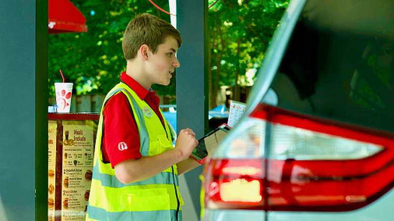 Man working in Chick-fil-A drive-thru