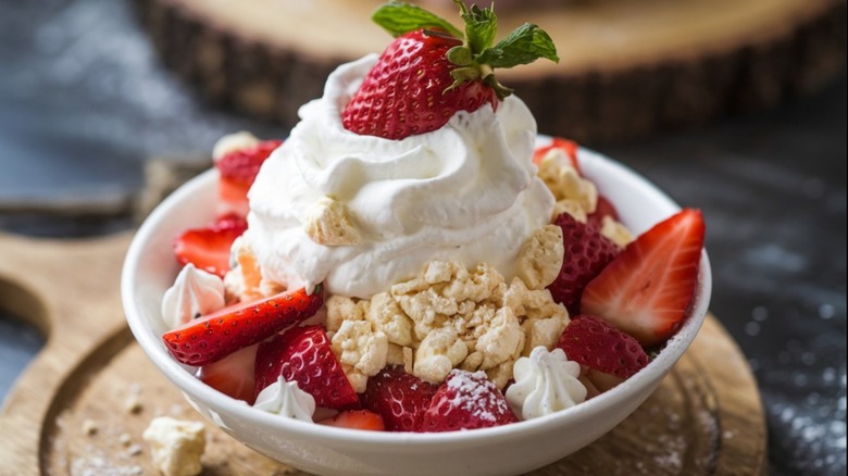 Eton Mess dessert combining crushed meringue, whipped cream, and fresh strawberries