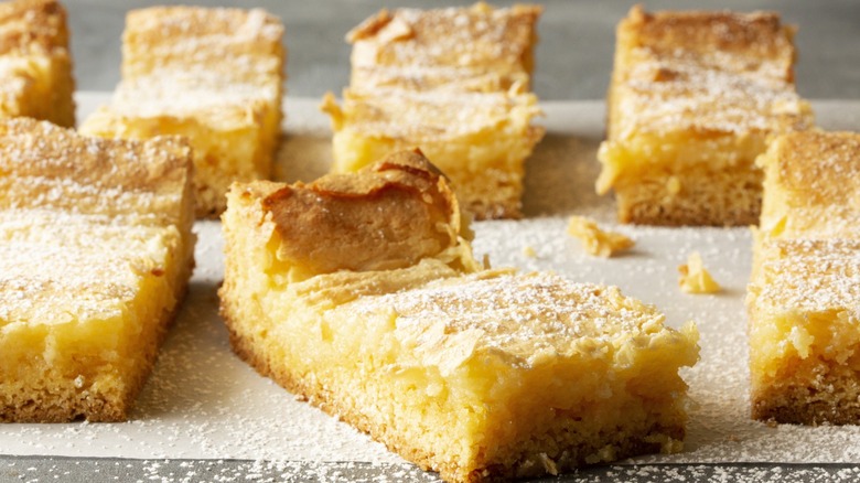 Gooey Butter Cake bars dusted with powdered sugar