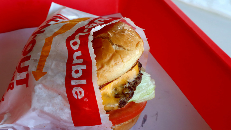 A close-up picture of a Double-Double In-N-Out burger in its wrapping.