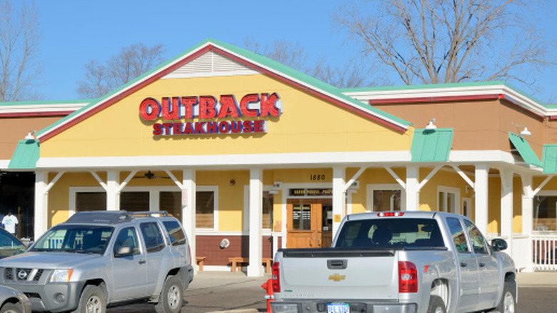 The exterior of an Outback Steakhouse in Rochester Hills, Michigan on a bright sunny day.