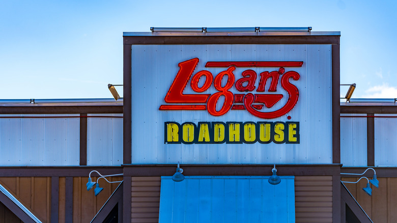 Logan's Roadhouse sign on a building in daylight