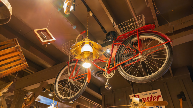 Interior view of the Cracker Barrel Old Country Store featuring a bicycle hanging from the ceiling