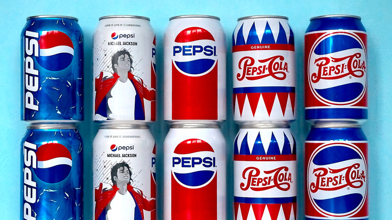 A lineup of various Pepsi cans with different designs, including retro logo and Michael Jackson design