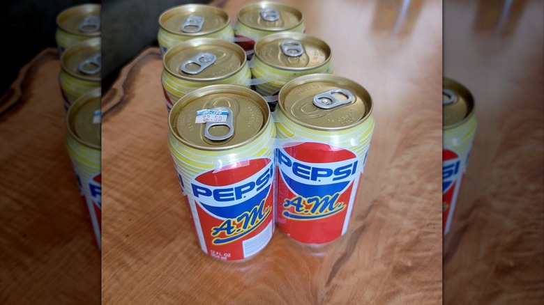Six pack of Pepsi A.M. cans on table