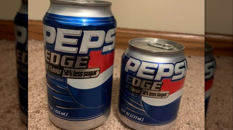 Two cans of Pepsi Edge on a counter, one can mini size