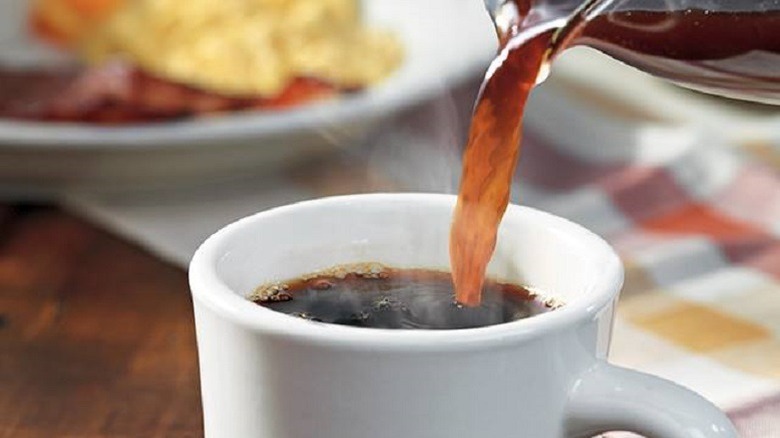 A close up of coffee being poured into a mug at Cracker Barrel