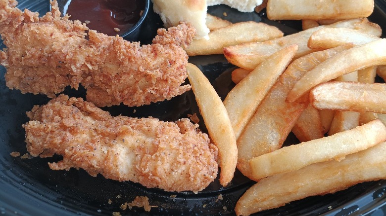 A close up of a chicken tender kids meal with fries from Cracker Barrel