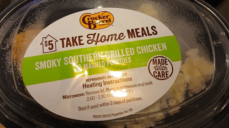 A picture of a packaged smoky southern grilled chicken $5 take home meal from Cracker Barrel
