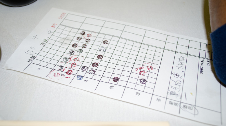 Check to be paid at Chinese dim sum restaurant