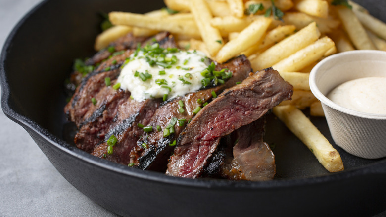 A skillet of steak frites