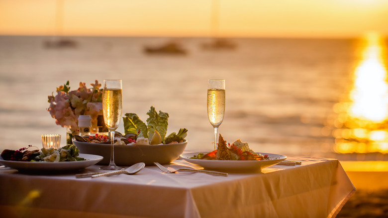 Romantic sunset dinner on the beach.