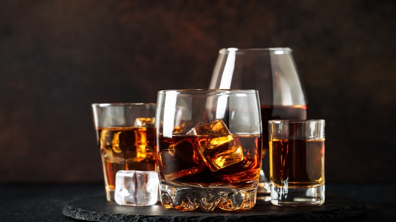 Multiple glasses of whisky.