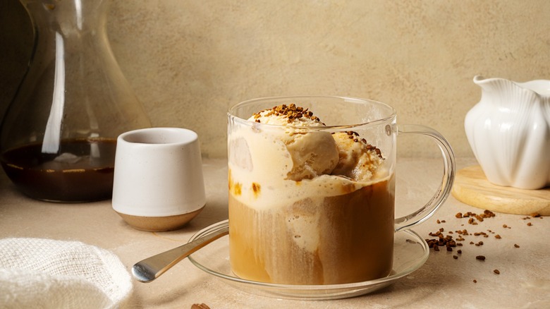 Affogato-style Italian dessert, espresso coffee and ice cream in glass mug