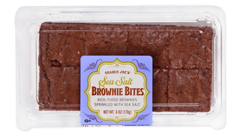 A plastic container of Trader Joe's Sea Salt Brownie Bites on white background