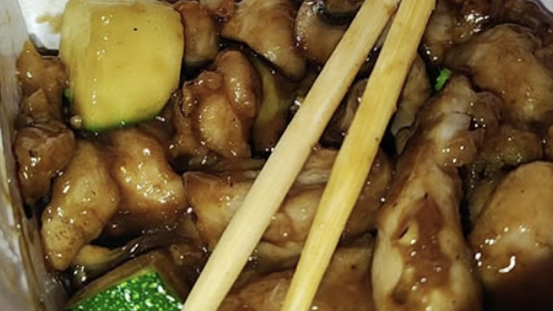 Panda Express mushroom chicken with chopsticks
