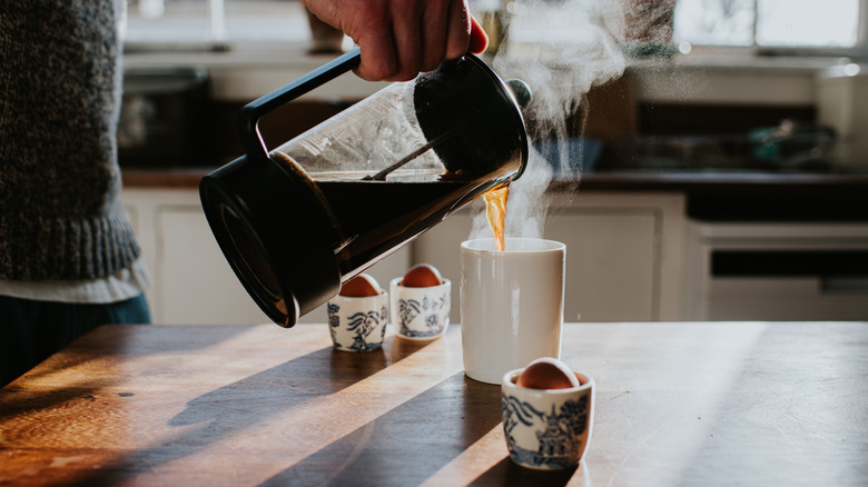 Coffee being poured into a mug