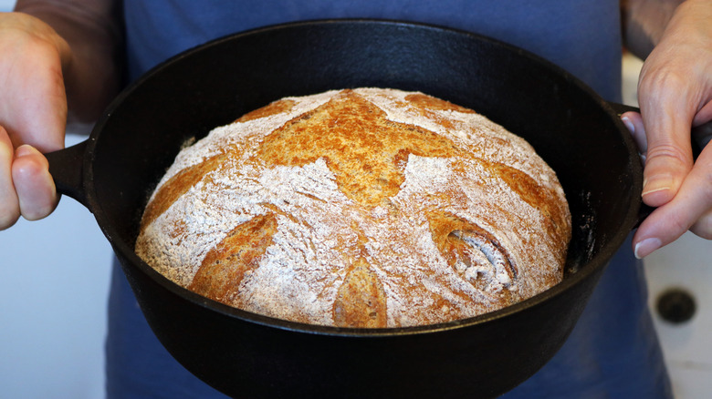 Close-up of a loaf of bread baked in a cast iron Dutch oven