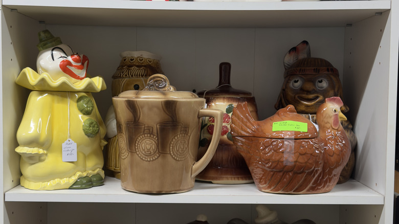 Vintage figural cookie jars for sale at an antique store