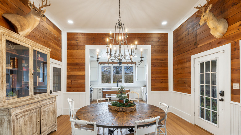 Remodeled Victorian home featuring elegant, modern amenities and wrought iron chandelier