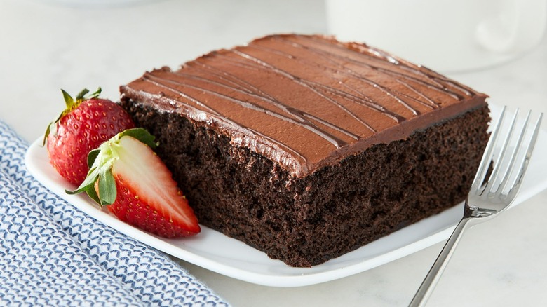 Walmart chocolate cake square with fresh strawberries on a plate