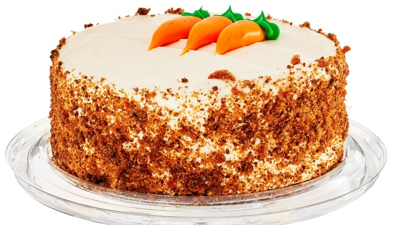 Whole Walmart Carrot Cake with decorative carrots in icing on top