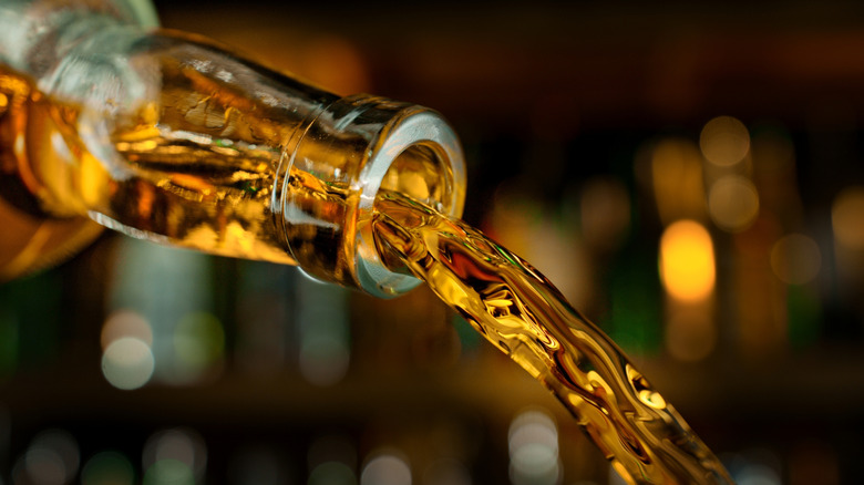 Whiskey pouring from a bottle