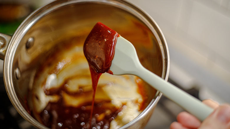 Spatula lifting caramel out of pan