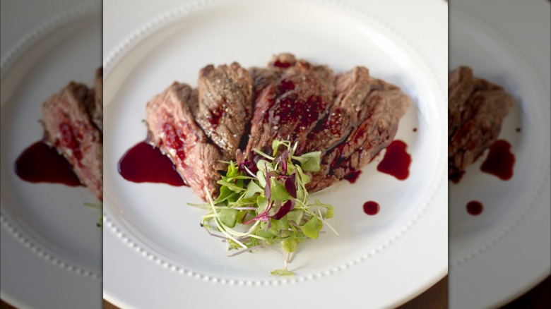 Sliced steak with gastrique sauce