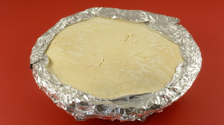 Frozen pie with aluminum foil collar